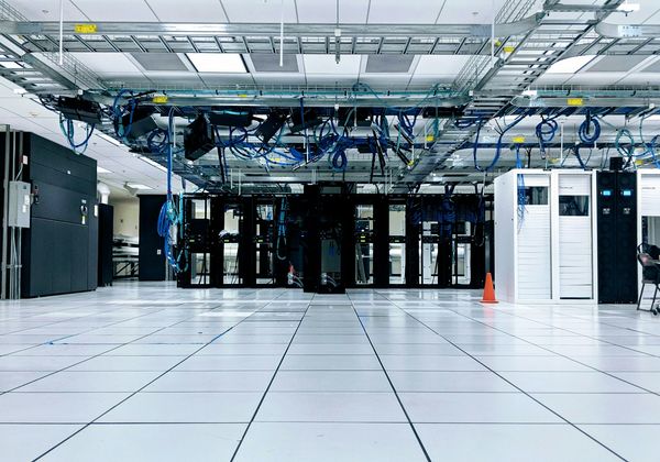 Rows of server cabinets on a data center floor